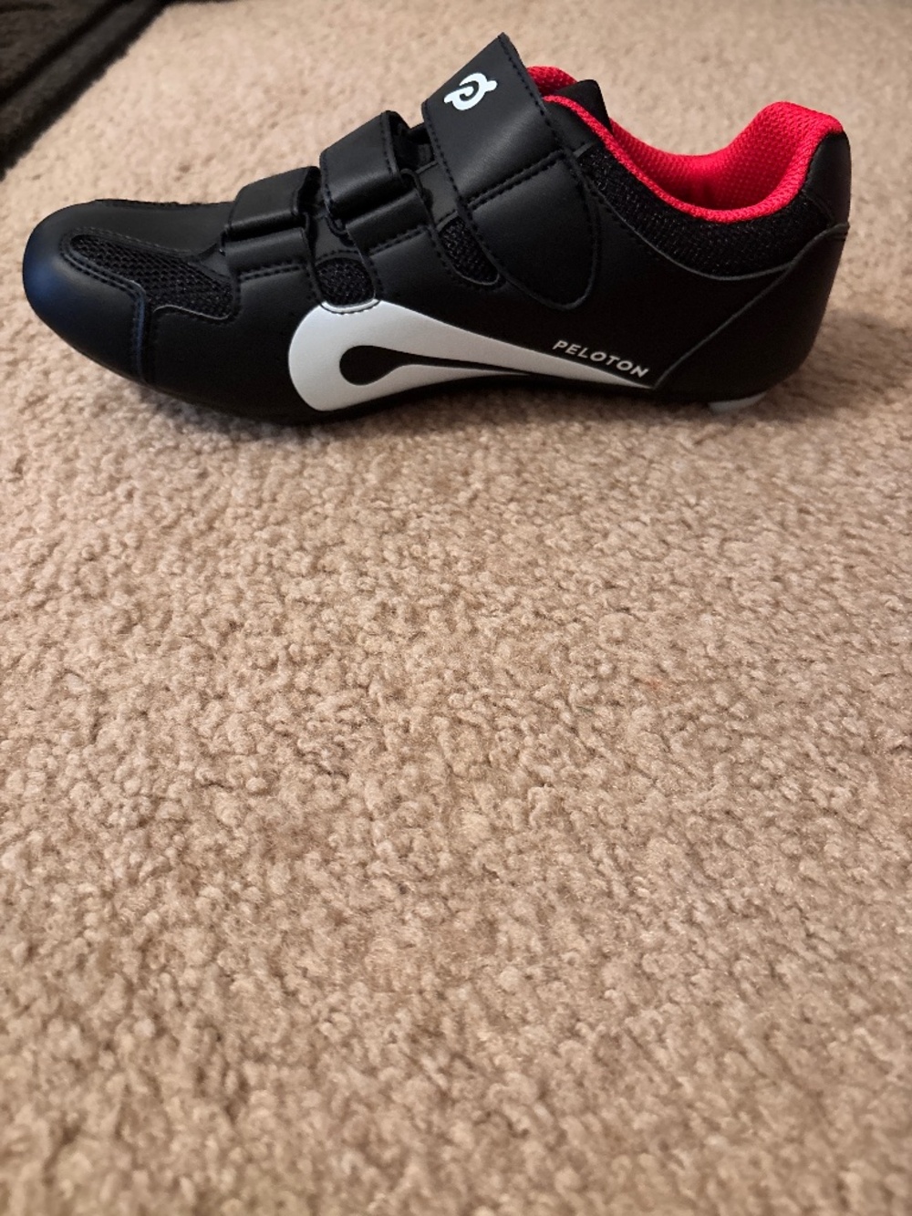 Peloton shoes and water bottle